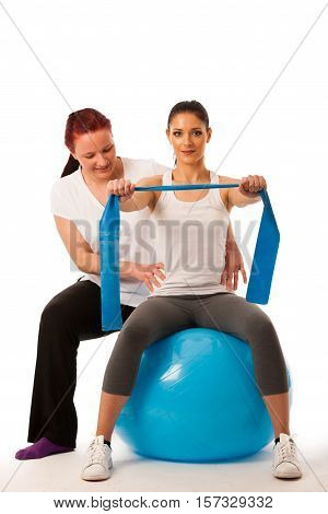 Physiotherapy - Therapist Doing Arm Strenghteninh Excercises With A Patient To Recover Strenght Afte