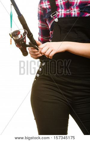 Fishing equipment concept. Woman holding fishing rod with green float. Isolated background.