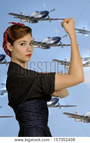Beautiful woman dressed as the iconic Rosie the Riveter