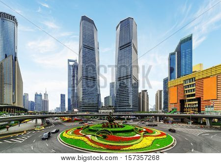 Skyscrapers And Colorful Flower Bed On Mingzhu Roundabout