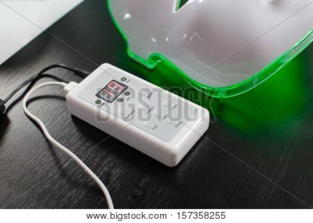 Light rejuvenating mask for facial skin therapy.