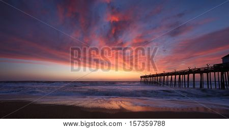 Panoramic of Kitty Hawk Pier House at sunrise in the Outer Banks