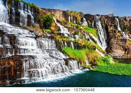 Natural Cascades Of Waterfall With Crystal Water At Summer