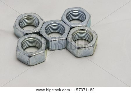 Some bolts and nuts on white background