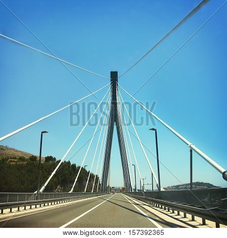 Car road on cable-stayed bridge, summer time