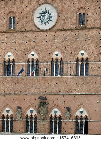 Siena - Gothic Palazzo Pubblico facade. Tuscany, Italy