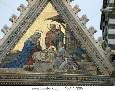 Siena - Duomo facade.The smaller mosaic Nativity of Jesus by Alessandro Franchi.
