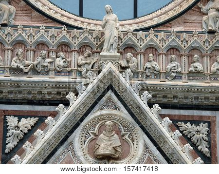 Architectural details of Duomo facade - SienaTuscanyItaly. The Duomo of Siena which was built in the 12th and 13th centuries is one of the prettiest churches in Gothic style in Italy