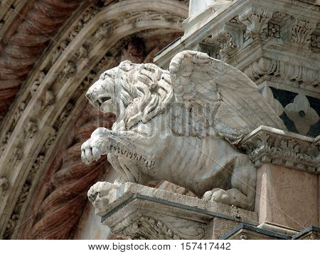 Architectural details of Duomo facade - SienaTuscanyItaly. The Duomo of Siena which was built in the 12th and 13th centuries is one of the prettiest churches in Gothic style in Italy
