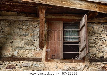 Window at one old Bulgarian house in the village of Kovachevitsa, Bulgaria