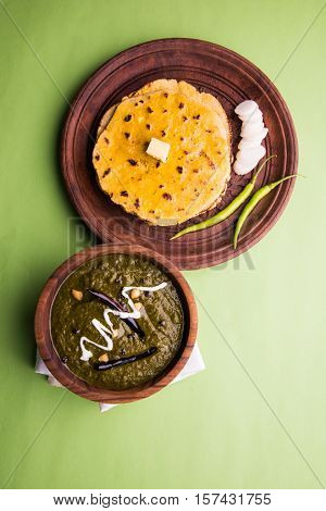 corn flour flat bread or roti or Makki Ki Roti with sarso da Saag or mustard leaves curry, Indian Food popular in winter season in north india