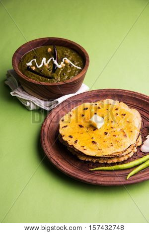 corn flour flat bread or roti or Makki Ki Roti with sarso da Saag or mustard leaves curry, Indian Food popular in winter season in north india