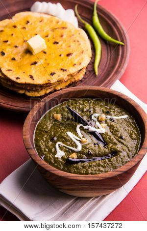 corn flour flat bread or roti or Makki Ki Roti with sarso da Saag or mustard leaves curry, Indian Food popular in winter season in north india