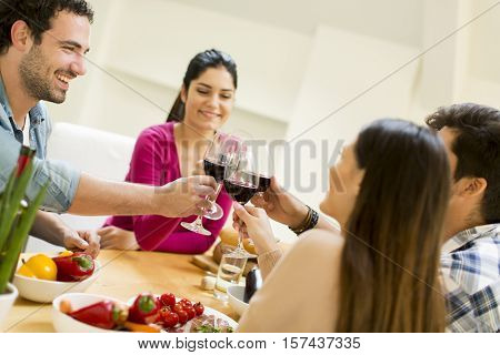 Young People Sitting By The Table
