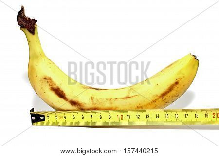 Large banana and measuring tape on white background