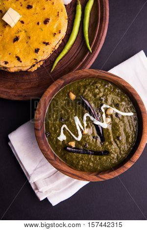 corn flour flat bread or roti or Makki Ki Roti with sarso da Saag or mustard leaves curry, Indian Food popular in winter season in north india