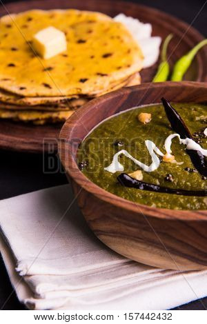 corn flour flat bread or roti or Makki Ki Roti with sarso da Saag or mustard leaves curry, Indian Food popular in winter season in north india