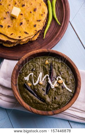 corn flour flat bread or roti or Makki Ki Roti with sarso da Saag or mustard leaves curry, Indian Food popular in winter season in north india