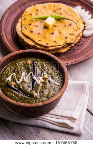 corn flour flat bread or roti or Makki Ki Roti with sarso da Saag or mustard leaves curry, Indian Food popular in winter season in north india