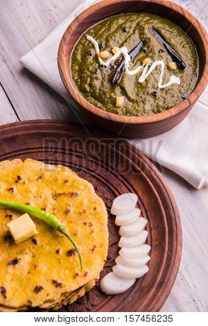 corn flour flat bread or roti or Makki Ki Roti with sarso da Saag or mustard leaves curry, Indian Food popular in winter season in north india