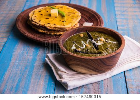 corn flour flat bread or roti or Makki Ki Roti with sarso da Saag or mustard leaves curry, Indian Food popular in winter season in north india