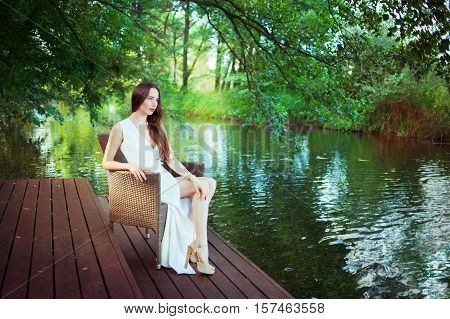 beautiful young girl in white dress outdoor