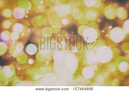 background with natural bokeh defocused sparkling lights. Colorful metallic texture with twinkling lights. Bright and vivid colors