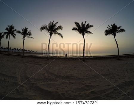 Man practicing yoga at the ocean beach in salalah Oman 4