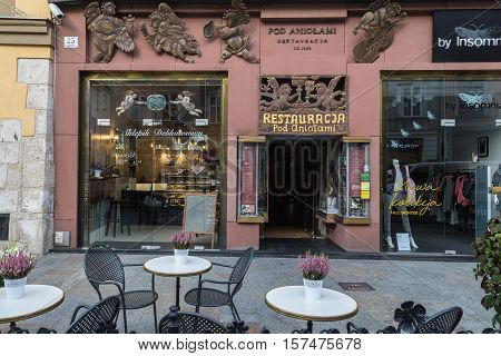 KRAKOW POLAND - 15TH OCTOBER 2016: The outside of shops and cafes along Grodzka street in Krakow during the morning.