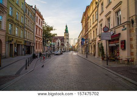 KRAKOW POLAND - 15TH OCTOBER 2016: A view along Grodzka street in Krakow during the morning. The outside of buildings and people can be seen.