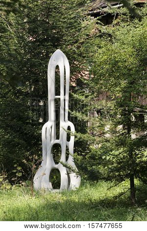 ZAKOPANE POLAND - SEPTEMBER 15 2016: An outdoors exhibited sculpture that is named Rakieta. It is made of reinforced concrete and is is located in a garden of studio of artist Henryk Burzec
