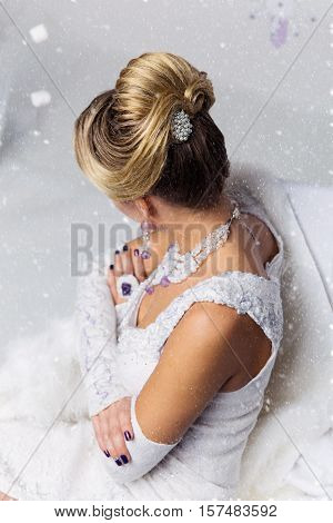 Close-up of beautiful wedding babette hairdo. Blonde bride. Copy space.