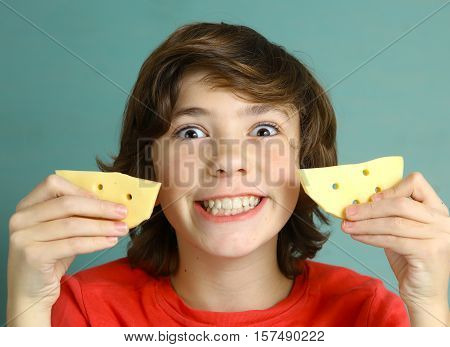 say cheese smile preteen boy with two cheese slices close up photo with white strong teeth