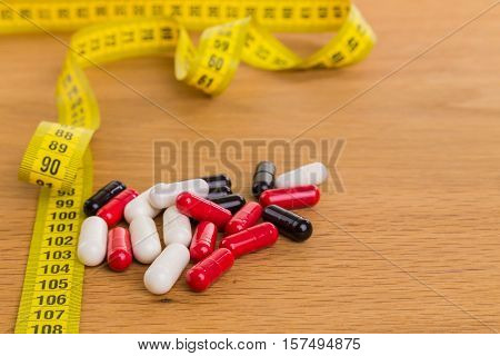 Diet pills on the table for maintaining a figure, an active lifestyle.