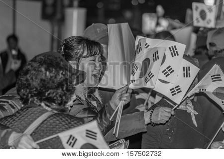 SEOUL, SOUTH KOREA, NOVEMBER 19,2016 Group of protesters outside Seoul Station rally against impeachment of President Park Geun-hye