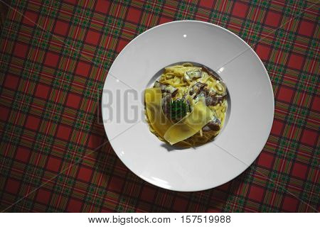 Top view shot of a plate of deliscious pasta dish.