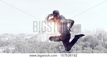 B-boy performing some moves . Mixed media