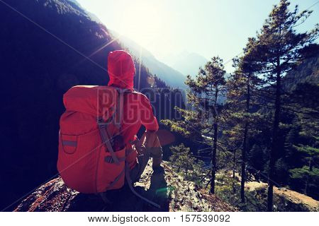 young woman backpacker enjoy the sunrise at the himalaya mountains