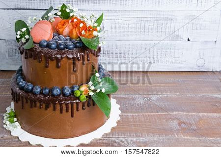 chocolate two layered wedding cake with roses