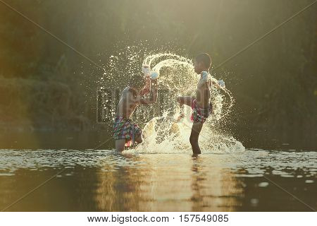 Training of children to a Thai boxer.