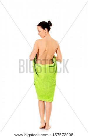 Young beautiful woman after bath full portrait isolated over white.