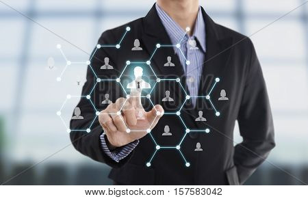 Businessman hand pressing icon on networking system concept employmentrecruitment hiring people social network communication.