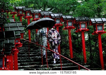 2 Kimono Ladies Struggled Through Rain To Measure Of Faith.