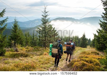 Travelers in the Carpathian mountains going down the hill