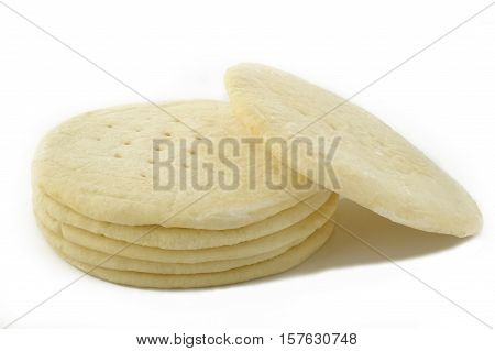 frozen ready-made pizza dough on white background