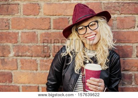 Happy woman having coffee in the morning