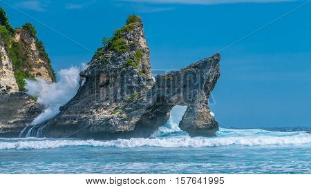Huge Wave hitting the Rock in the ocean at Atuh beach on Nusa Penida island, Indonesia.