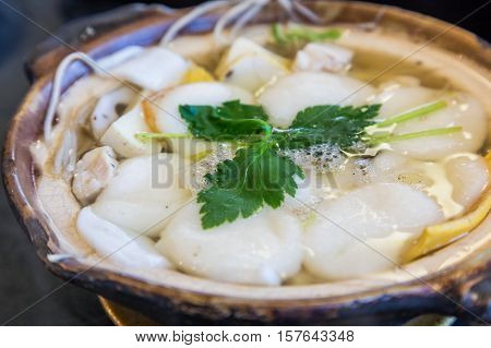 Traditional Shimabara Guzoni - Soup With Rice Cake And Seafood
