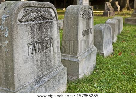 Father & mother tombstones in a cemetery