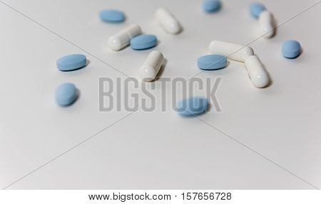 White & Blue Pills on a white background